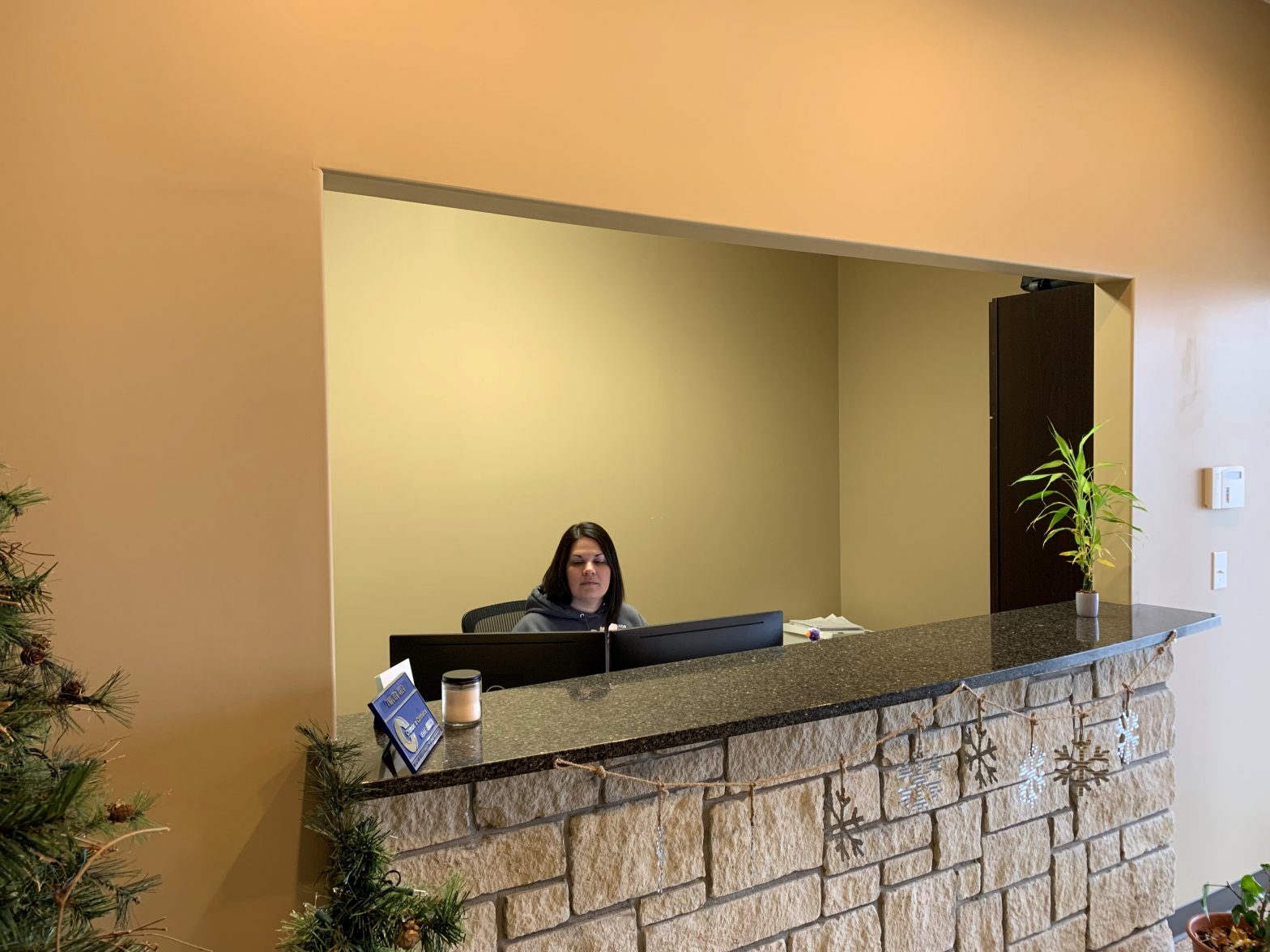 Office Assistant at a desk